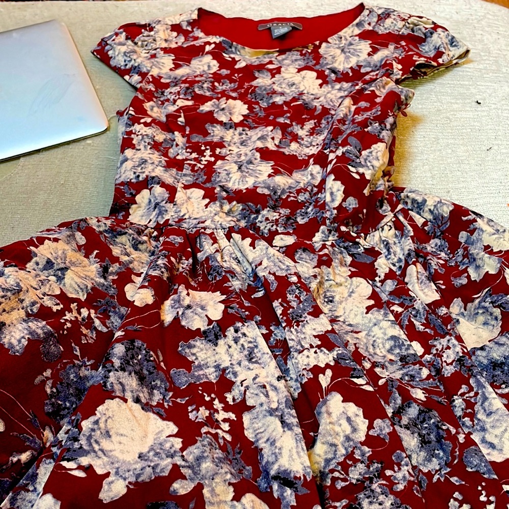It’s a sleek dress all floral red with blue and white flowers